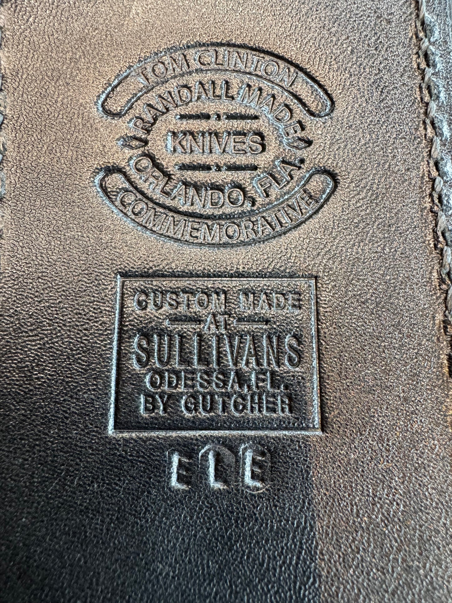 Randall Tom Clinton Dealer Special. Clinton Blade etched Commemorative 1/100 in a nice piece of Walnut. Very cool matching Elephant Gutcher sheath. Nickel Silver Hilt and Aluminum Coolie Butt cap. Included in black facsimile Tom Clinton case.