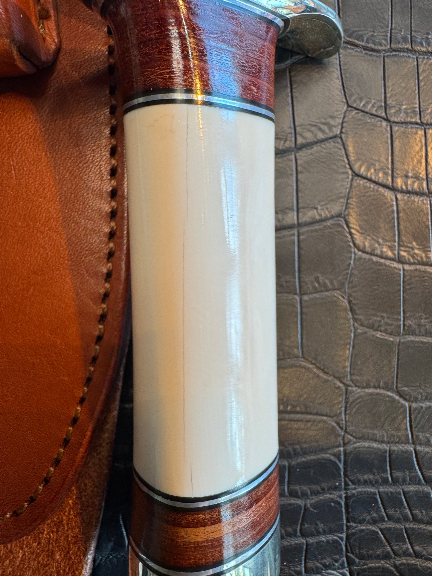 Randall Model 12/9-14 Grind Sportsman Bowie in Elephant Ivory with stacked Leather, Nickel Silver Hilt and Butt cap.