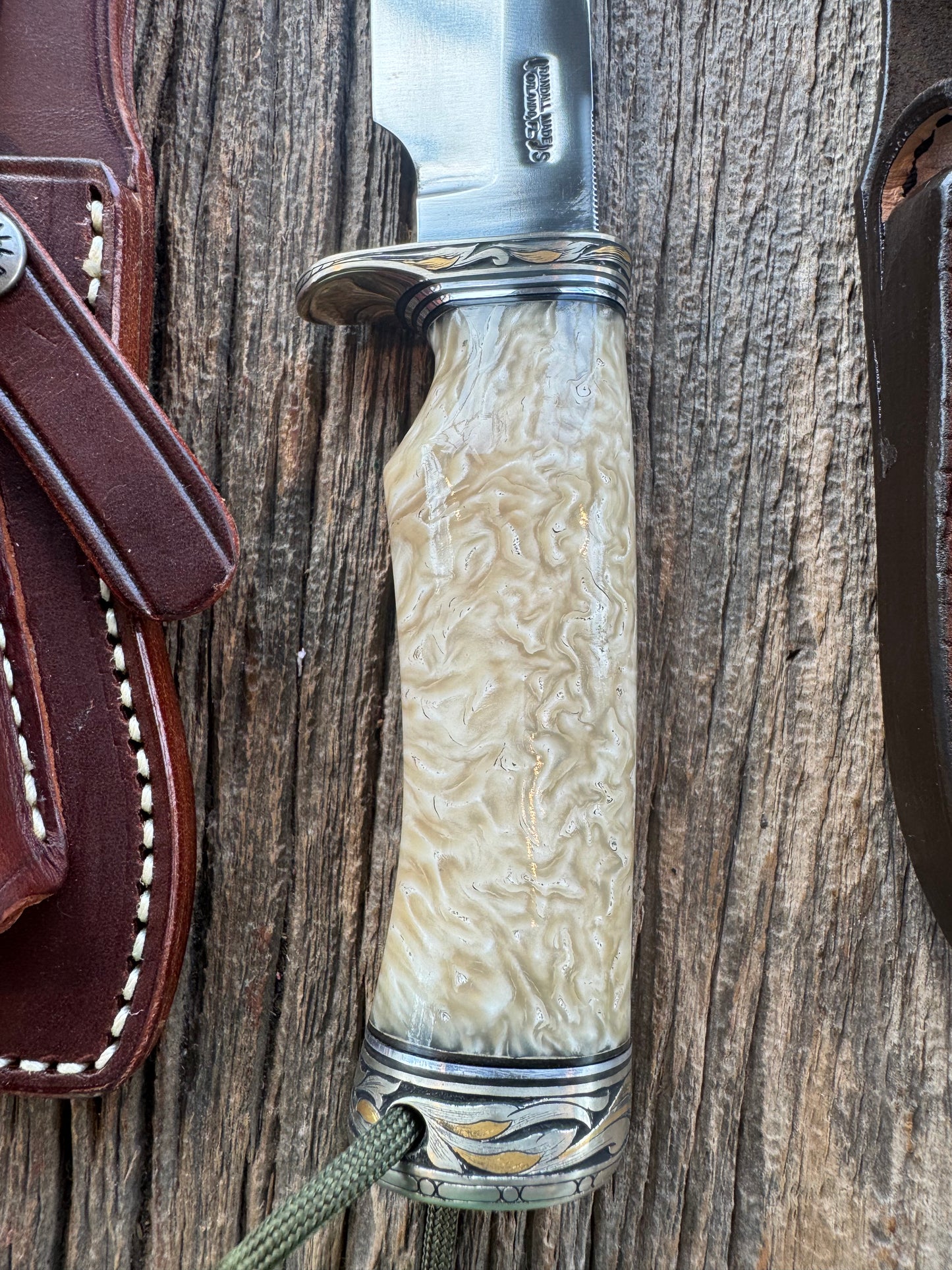 Randall Model Bowles Skinner Dealer Special Knife, perfect Musk Ox. This knife is a one of 4 per Rick Bowles. Beautifully engraved by Jere Davidson and adorned with gold and silver inlays.