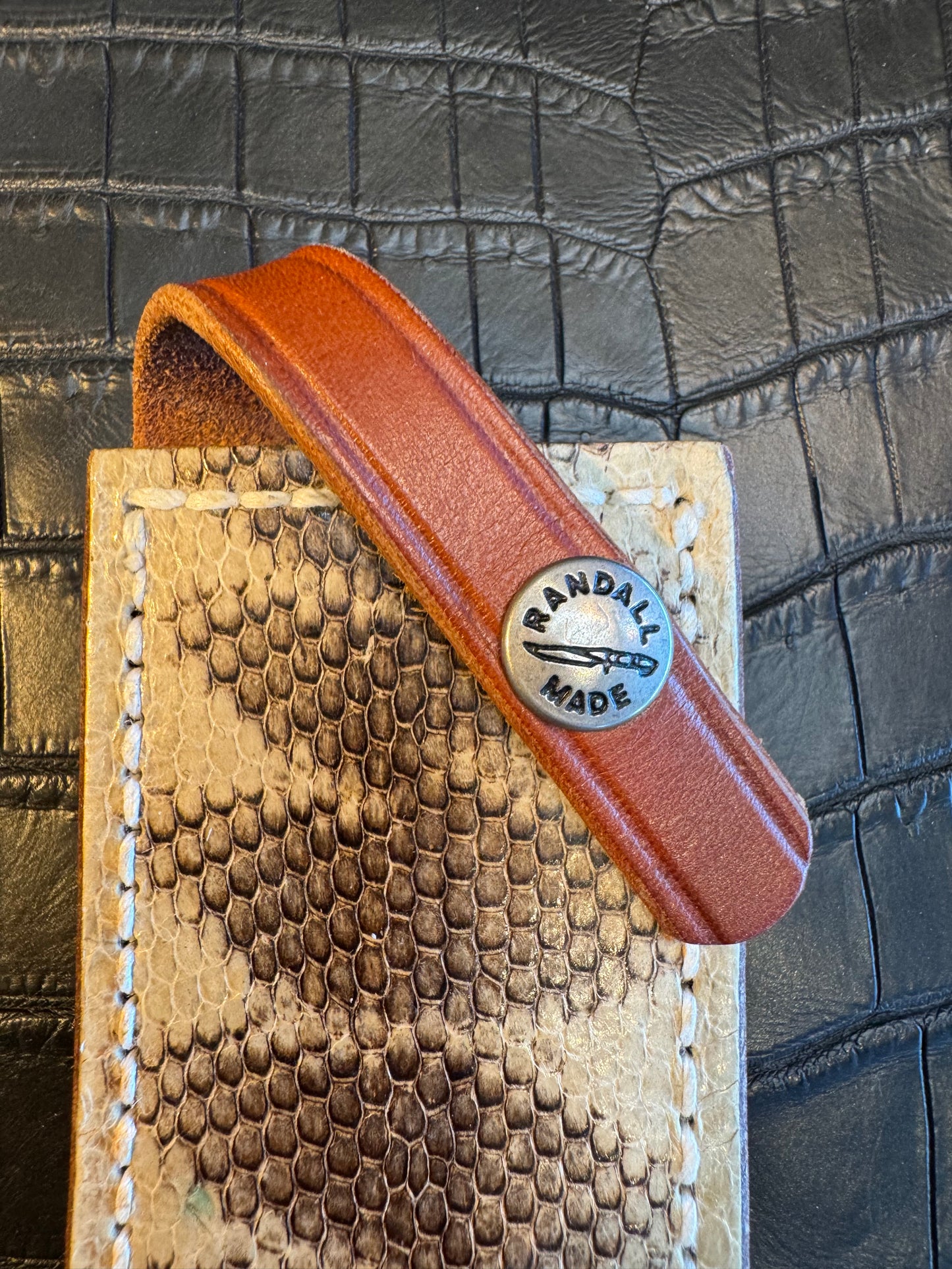 Randall Model 1-7 or 2-7 Exotic Snake skin in a low rise or high boy Sheath from Sullivans by Gutcher.