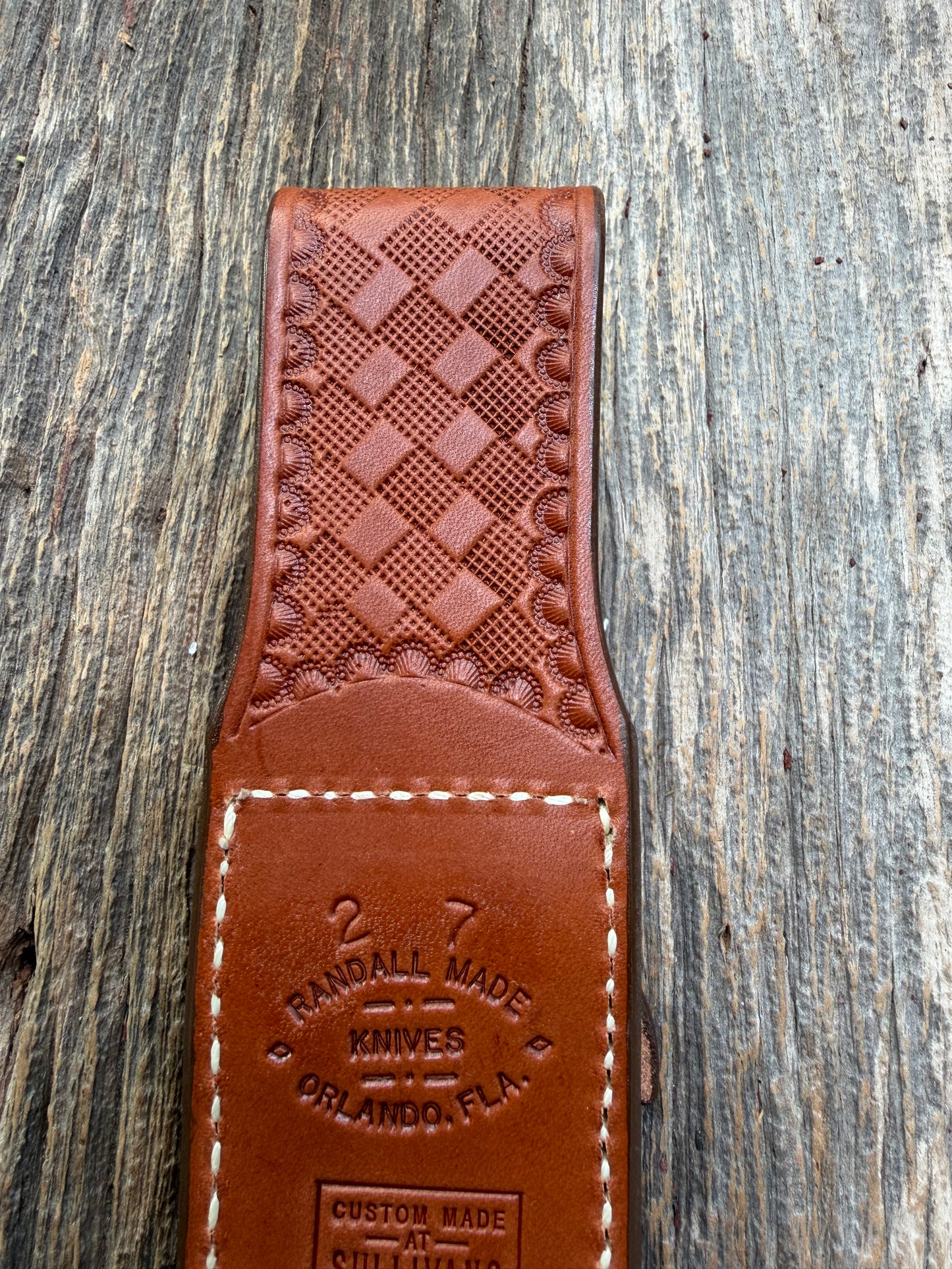 Pristine Randall Model 2-7 sheath in Exotic Cape Buffalo leather from Sullivans by Gutcher. Heavily tooled belt loop and strap. Randall snap and clean stamping on the back … perfect!!