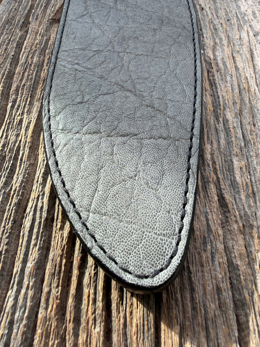 New Randall Model 12-11 Large Sasquatch Sheath in Exotic thick and textured Grey Elephant Hide on black leather from Treeman with a black Canteen snap. Hand tooled belt loop. Killer sheath.