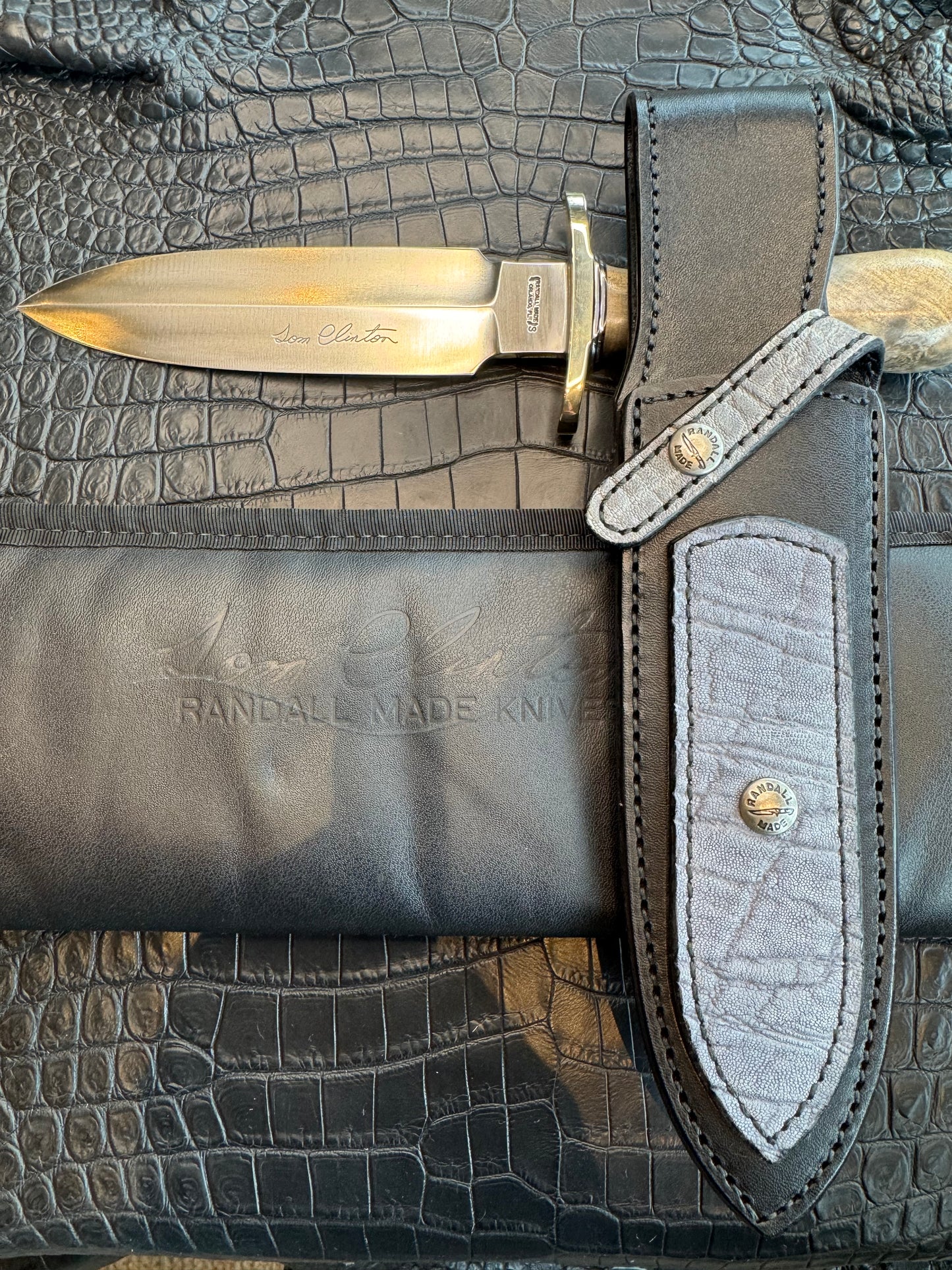Randall Tom Clinton Dealer Special. Clinton Blade etched Commemorative 1/100 in a nice piece of Walnut. Very cool matching Elephant Gutcher sheath. Nickel Silver Hilt and Aluminum Coolie Butt cap. Included in black facsimile Tom Clinton case.