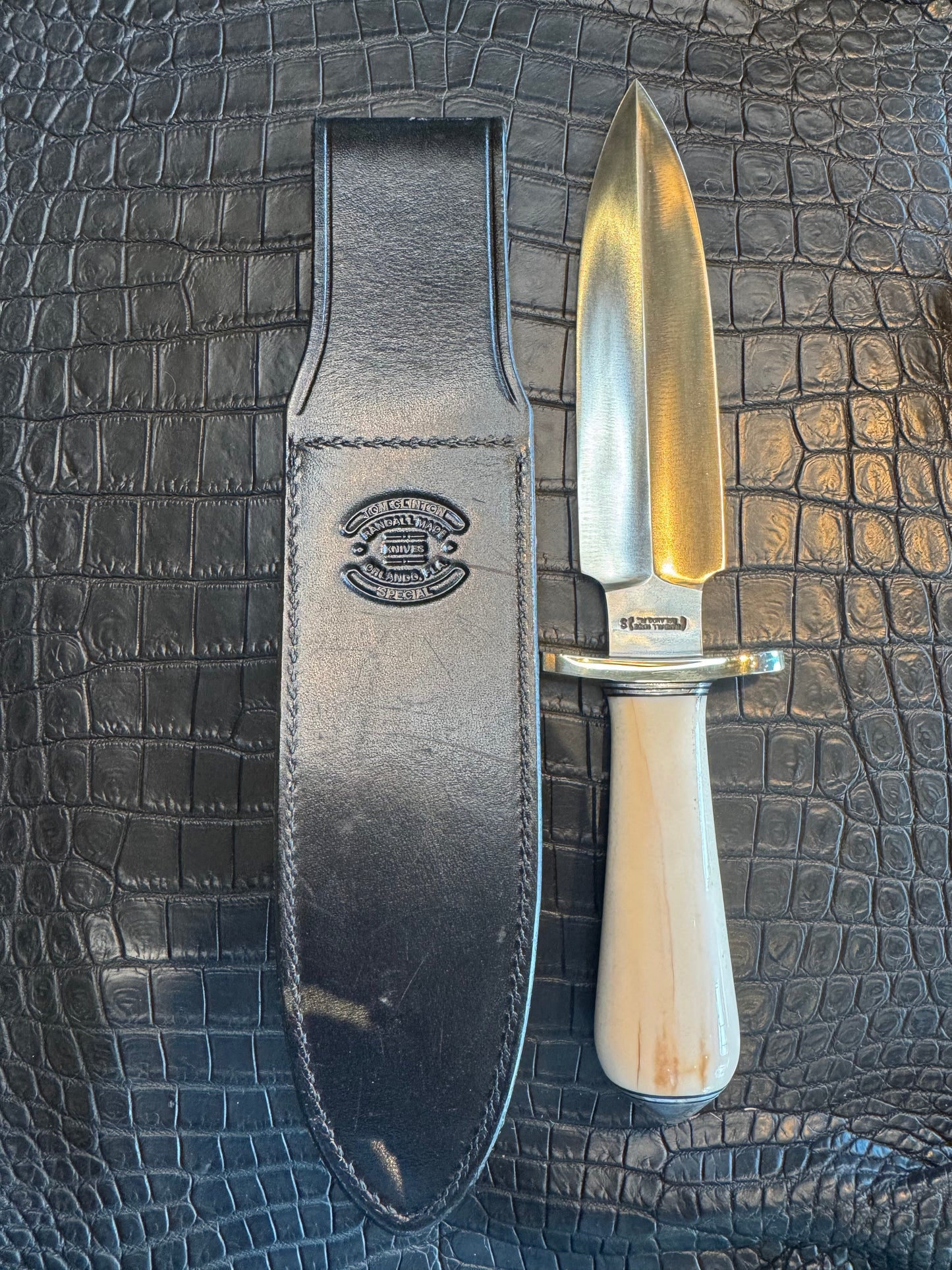 Randall Tom Clinton Dealer Special in a gorgeous piece of Creamy Fossil Walrus Ivory. Nickel Silver Hilt and Aluminum Flanged Butt cap.