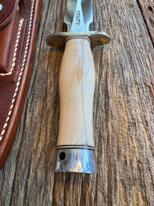 Randall Knife Model 2-7 Creamy Fossil Walrus Handle. Older model with beautiful green and white spacers. Handle is cracked ( see pics) Stainless Steel, Nickel silver Hilt and aluminum butt cap with lanyard.