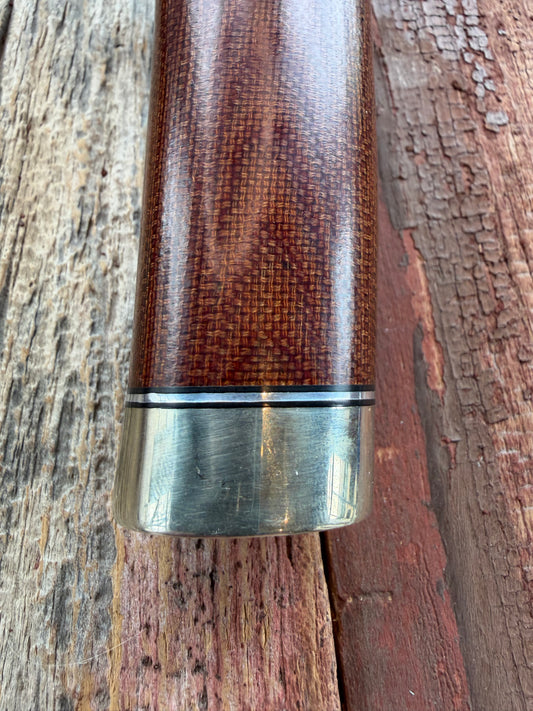 New in Paper Randall Model 19-5 Bushmaster with an Brown Micarta handle. SS blade, Nickel silver single hilt. Lanyard. Brown leather sheath.