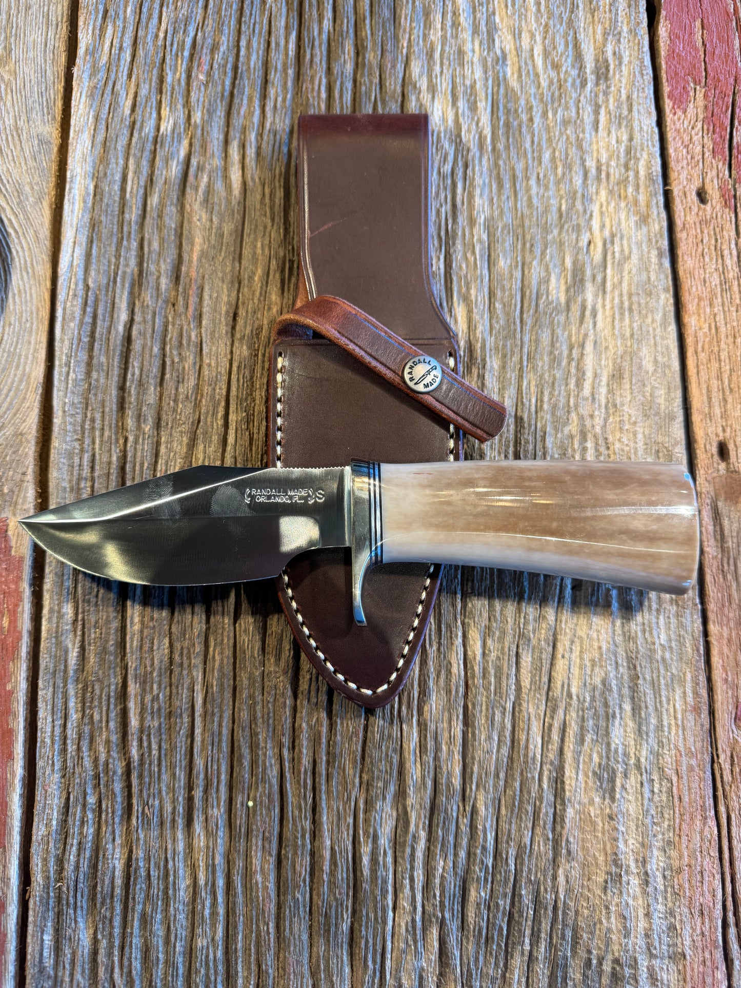 Randall Model 19-4 in Beautiful Fossil Walrus Ivory. Gorgeous colors and very rare to see a 19 in FWI. Nickel Silver Single Hilt and natural end, SS, and Flawless