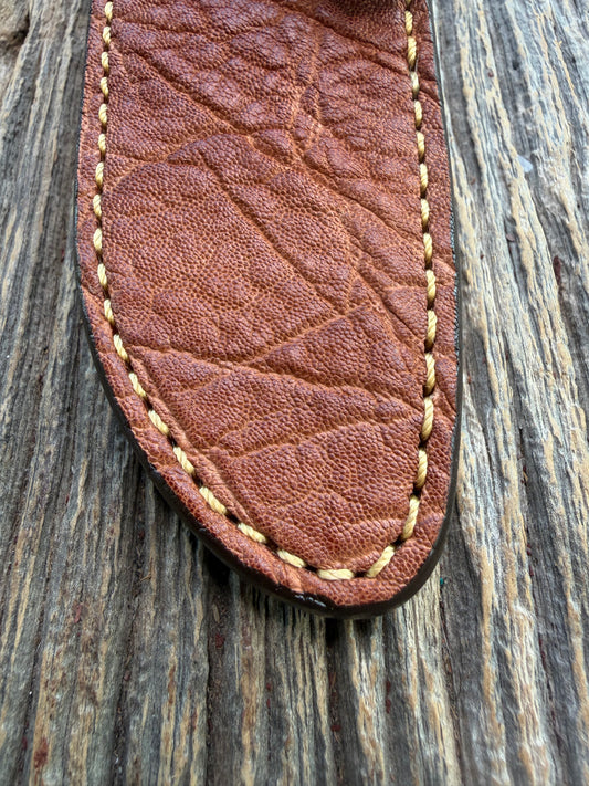 New Randall Model 23 Sheath in Exotic thick and textured Rust colored Elephant hide on brown leather from Treeman with a silver Canteen snap. Hand tooled belt loop. Killer sheath.