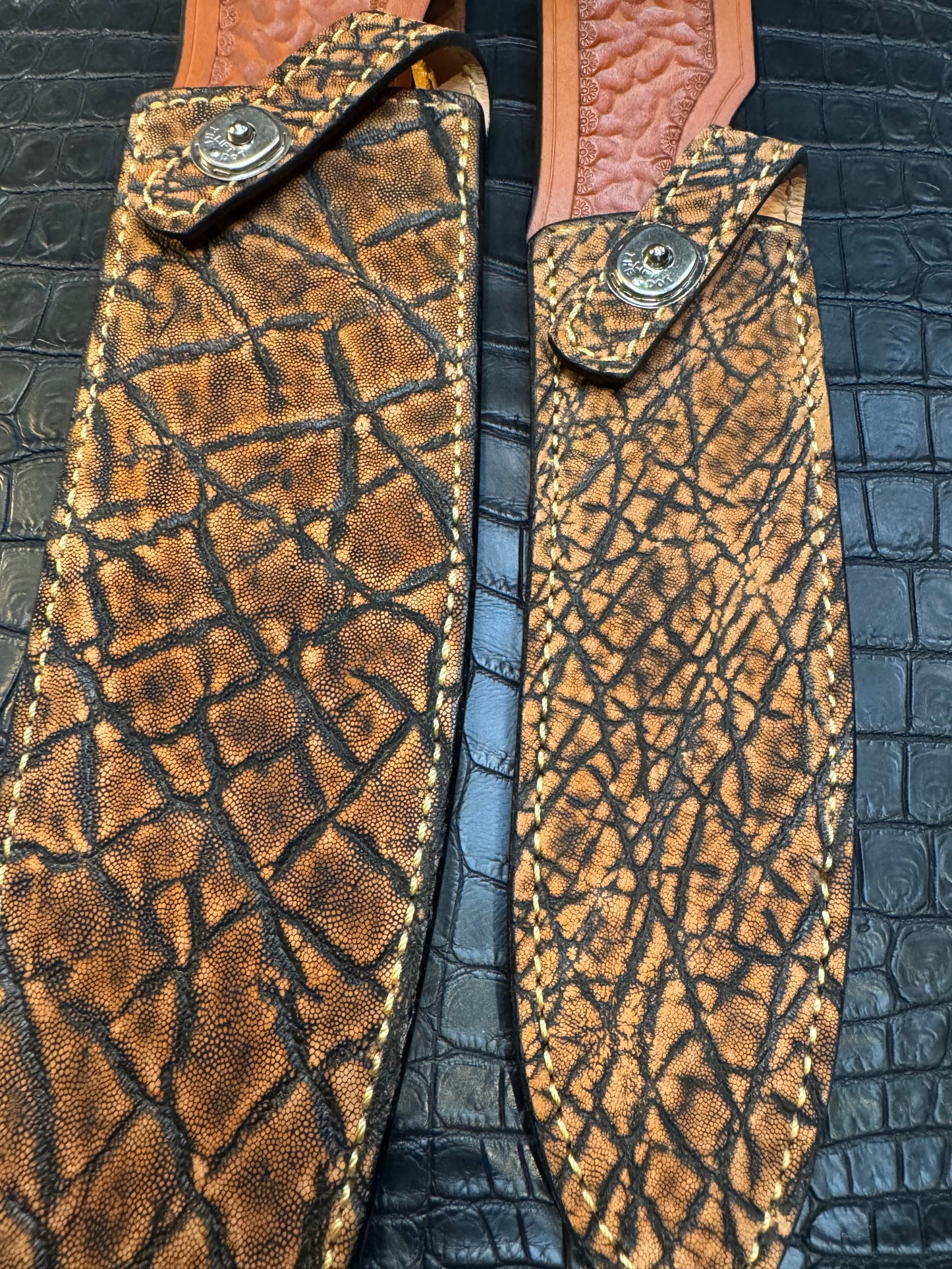 A pair of Randall Model 12-11 Large Sasquatch and Randall Model 12-8 Small Sasquatch Sheaths in Exotic Cognac Elephant by Treeman.