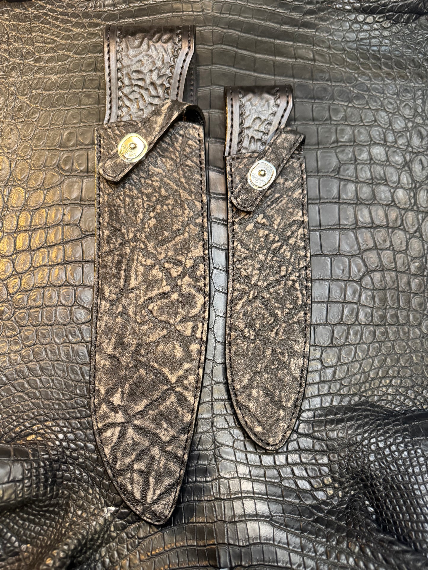 A pair of Randall Model 12-11 Large Sasquatch and Randall Model 12-8 Small Sasquatch Sheaths in Exotic Black Elephant by Treeman.