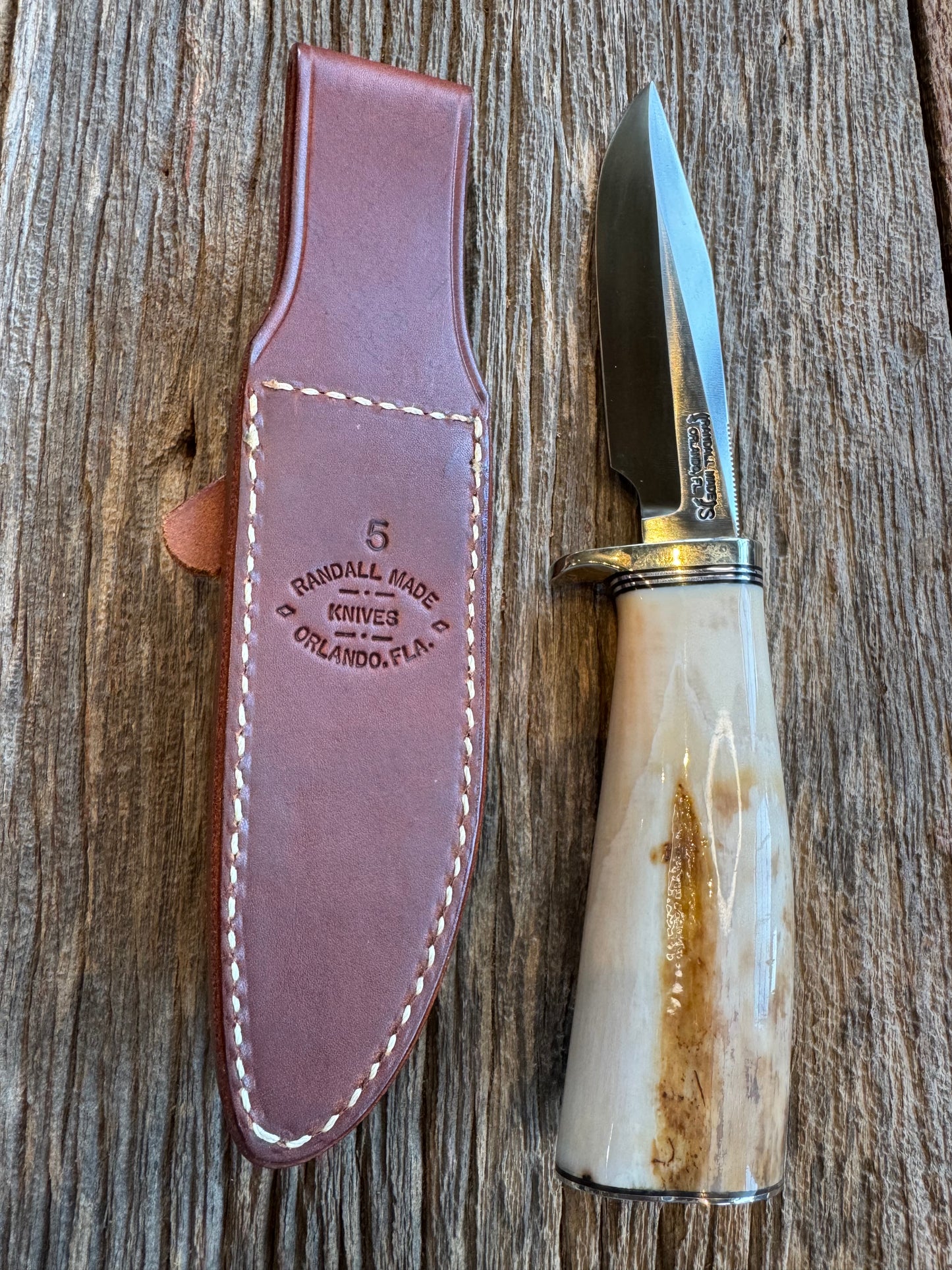 Randall Knife Model 5-5 Creamy Fossil Walrus Handle. Rare model you don’t see often. Handle is beefy and special. Flawless Ivory, Stainless Steel, Nickel silver Hilt and butt plate.
