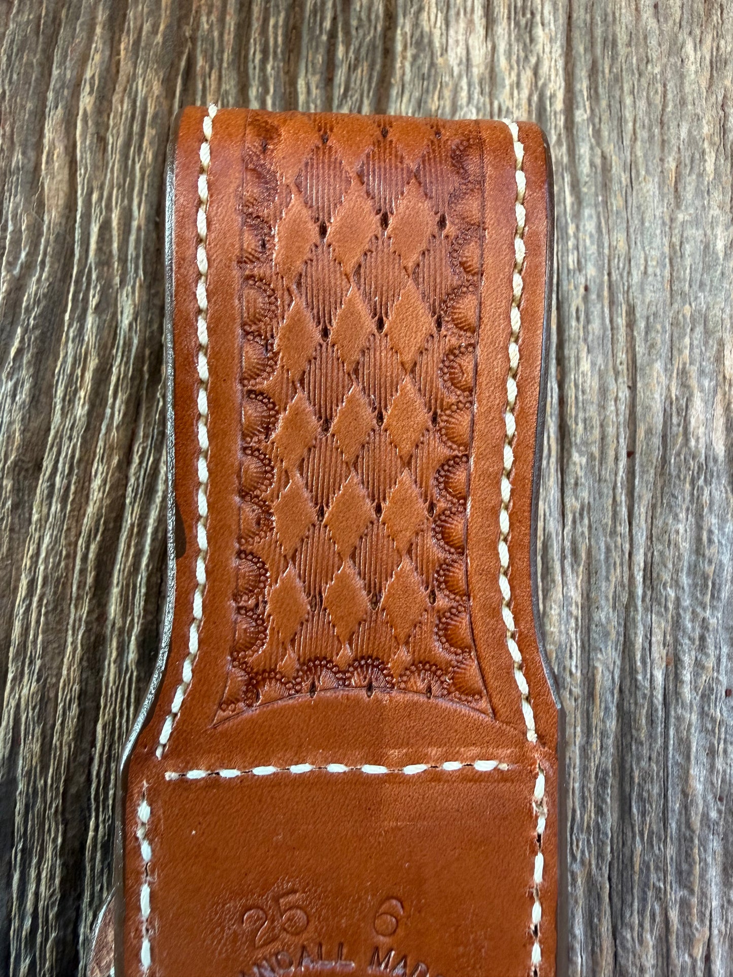 New Randall Model 25-6 Sheath in Exotic Brown Cape Buffalo with full leather hand tooled belt loop. Randall snap and stamp on the back. Custom Made at Sullivan’s by Gutcher