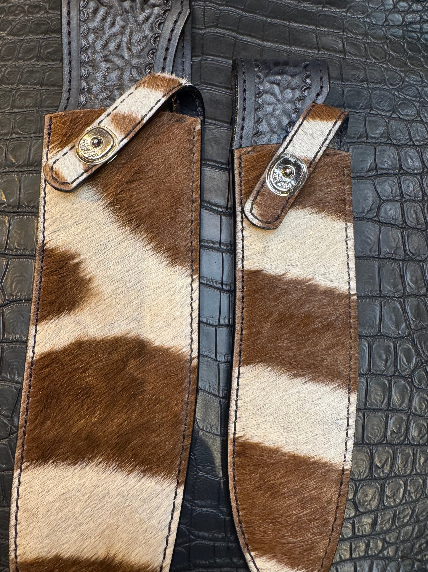A pair of Randall Model 12-11 Large Sasquatch and Randall Model 12-8 Small Sasquatch Sheaths in Exotic Zebra by Treeman.