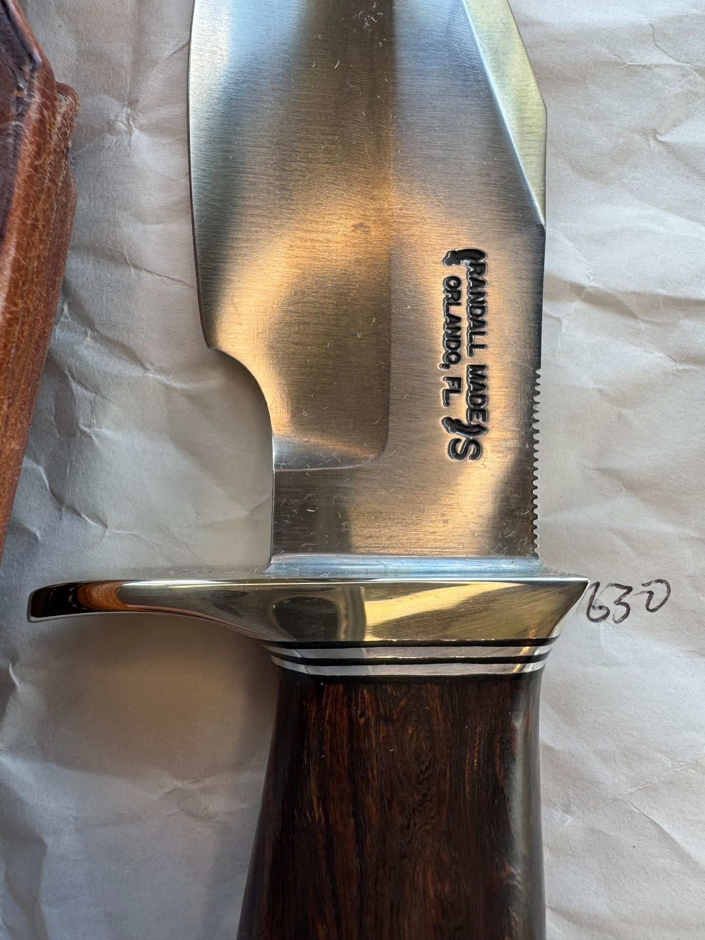 New in Paper Randall Model 19-5 Bushmaster with an Ironwood handle. SS blade, Nickel silver single hilt. Brown leather sheath.