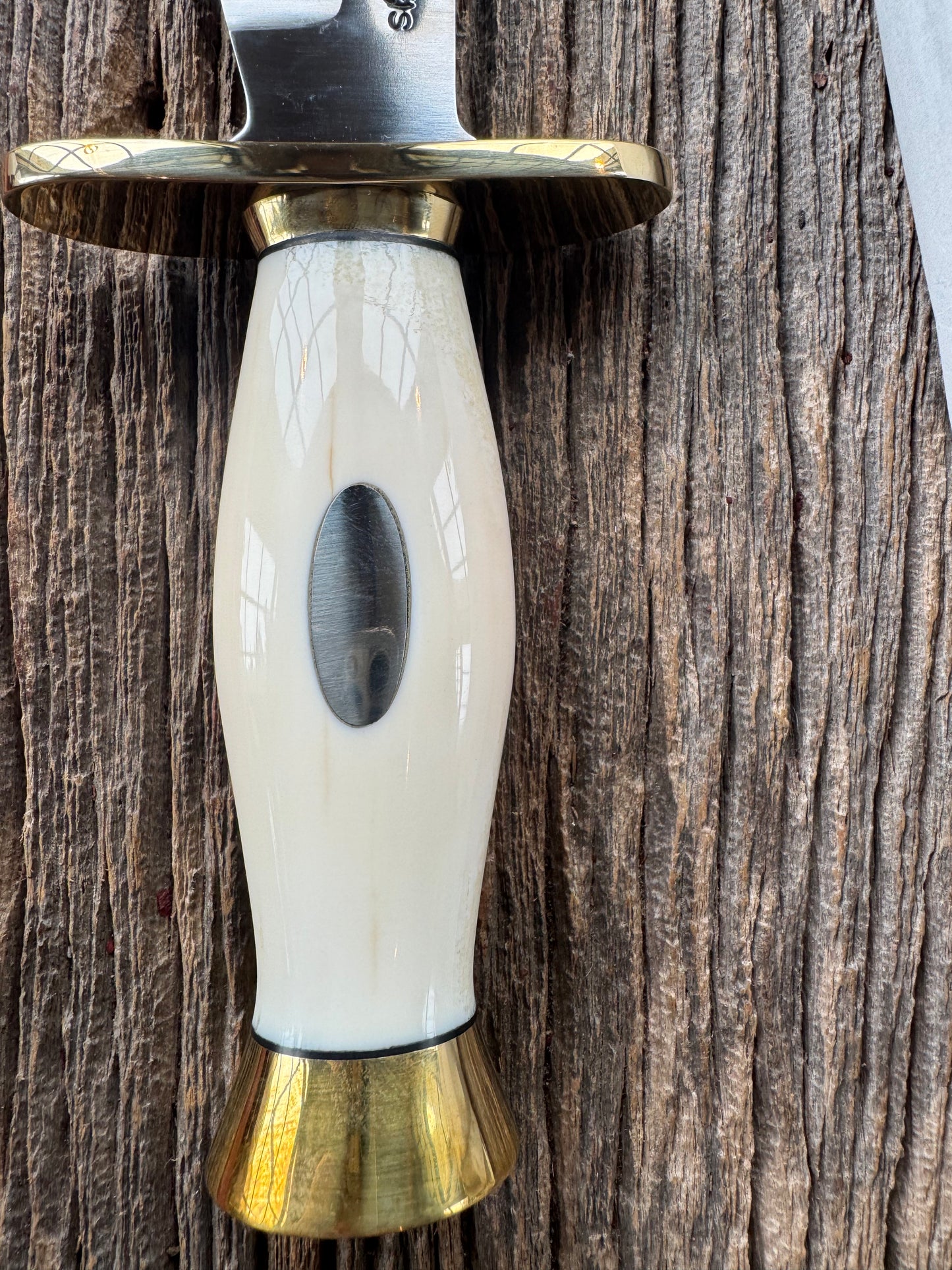 New in paper Randall Knife Model 12-8 Big Bear. Gorgeous piece of off white Fossil Walrus Ivory. Brass hilt, collar and butt cap, Stainless steel.