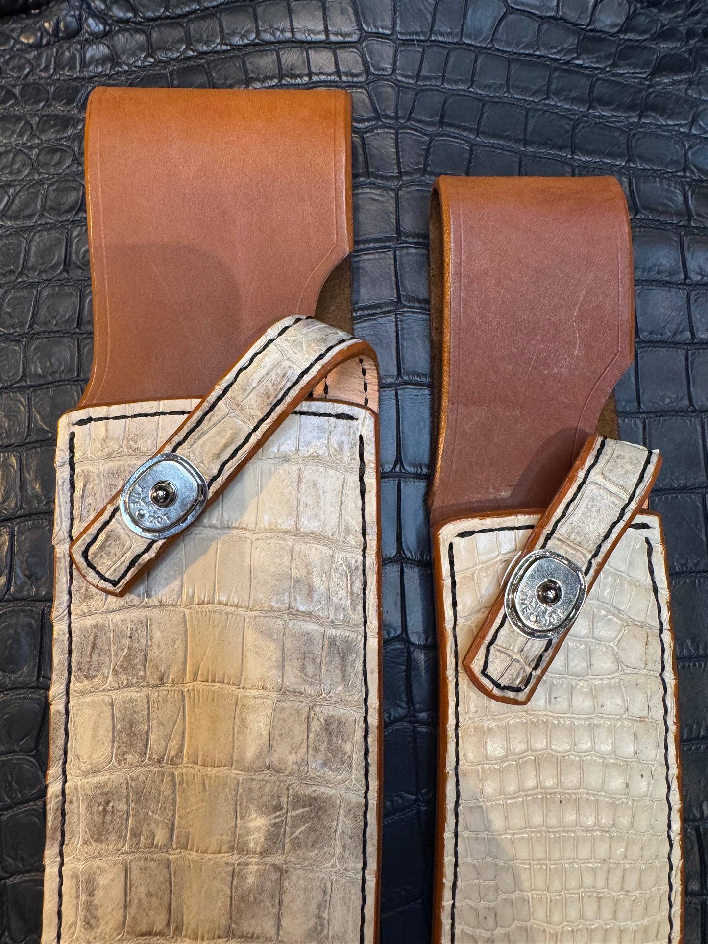 A pair of Randall Model 12-11 Large Sasquatch and Randall Model 12-8 Small Sasquatch Sheaths in Exotic Ivory Crocodile by Treeman.