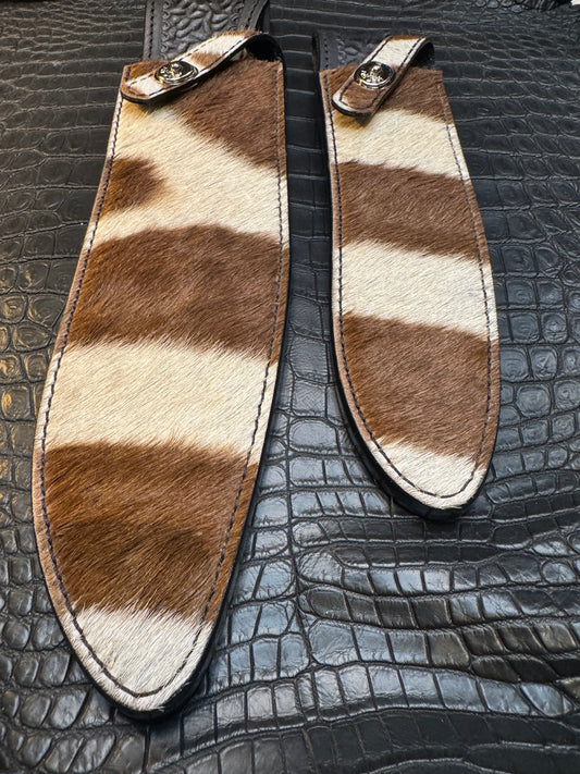 A pair of Randall Model 12-11 Large Sasquatch and Randall Model 12-8 Small Sasquatch Sheaths in Exotic Zebra by Treeman.