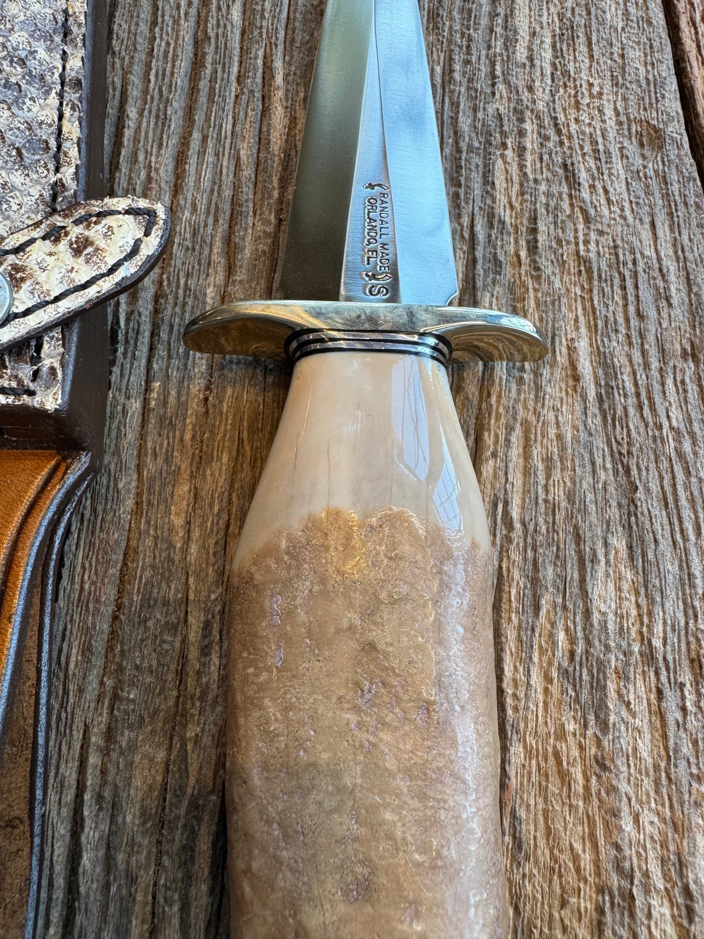 Randall Knife Model 13-6 Small Arkansas Toothpick Artifact. Fossil Walrus in an Ice Ax Handle. Included is a very rare Gutcher Rattlesnake sheath, Stainless Steel.