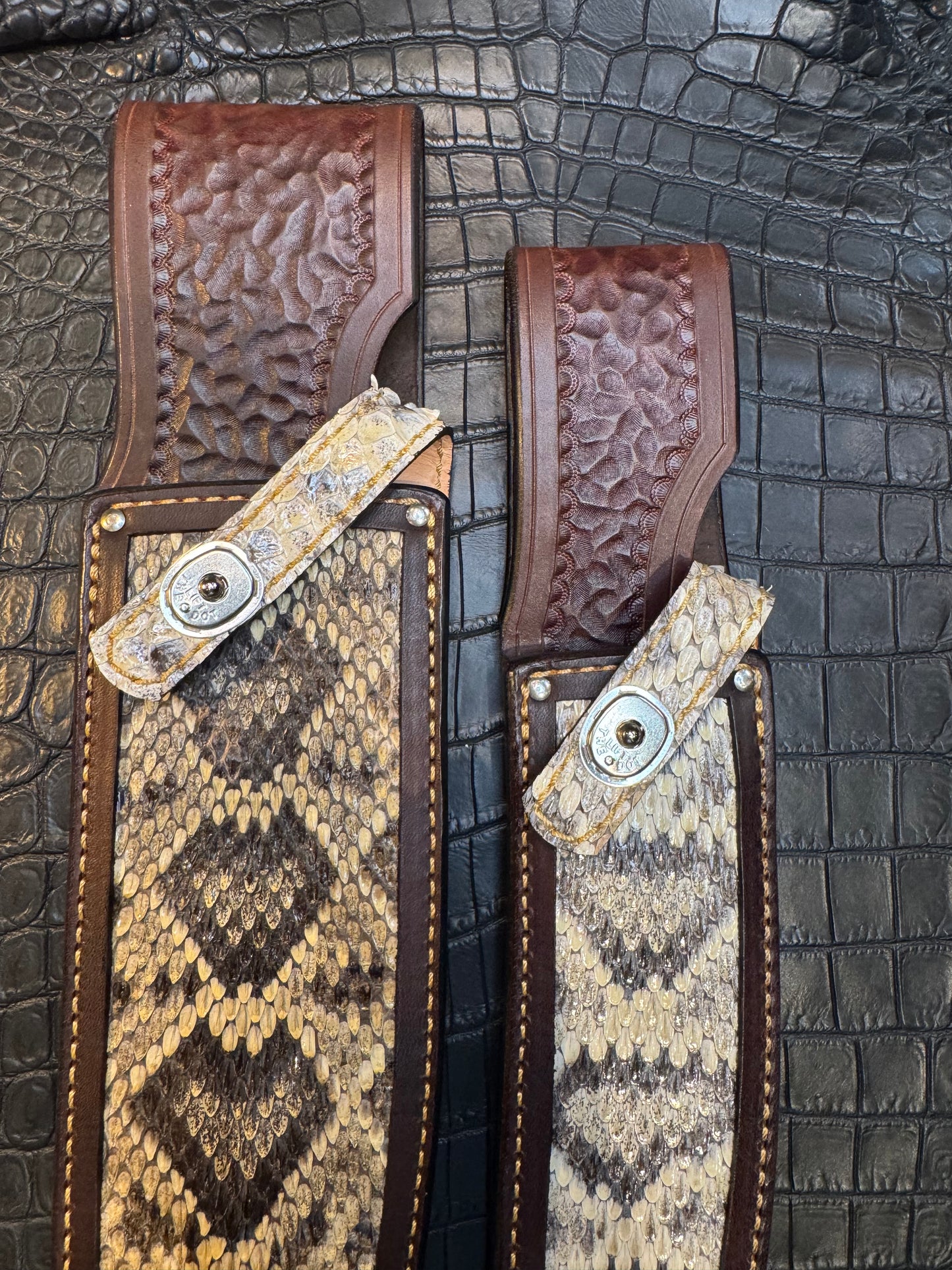 A pair of Randall Model 12-11 Large Sasquatch and Randall Model 12-8 Small Sasquatch Sheaths in Exotic Vibrant Diamond Pattern Rattlesnake skin by Treeman.