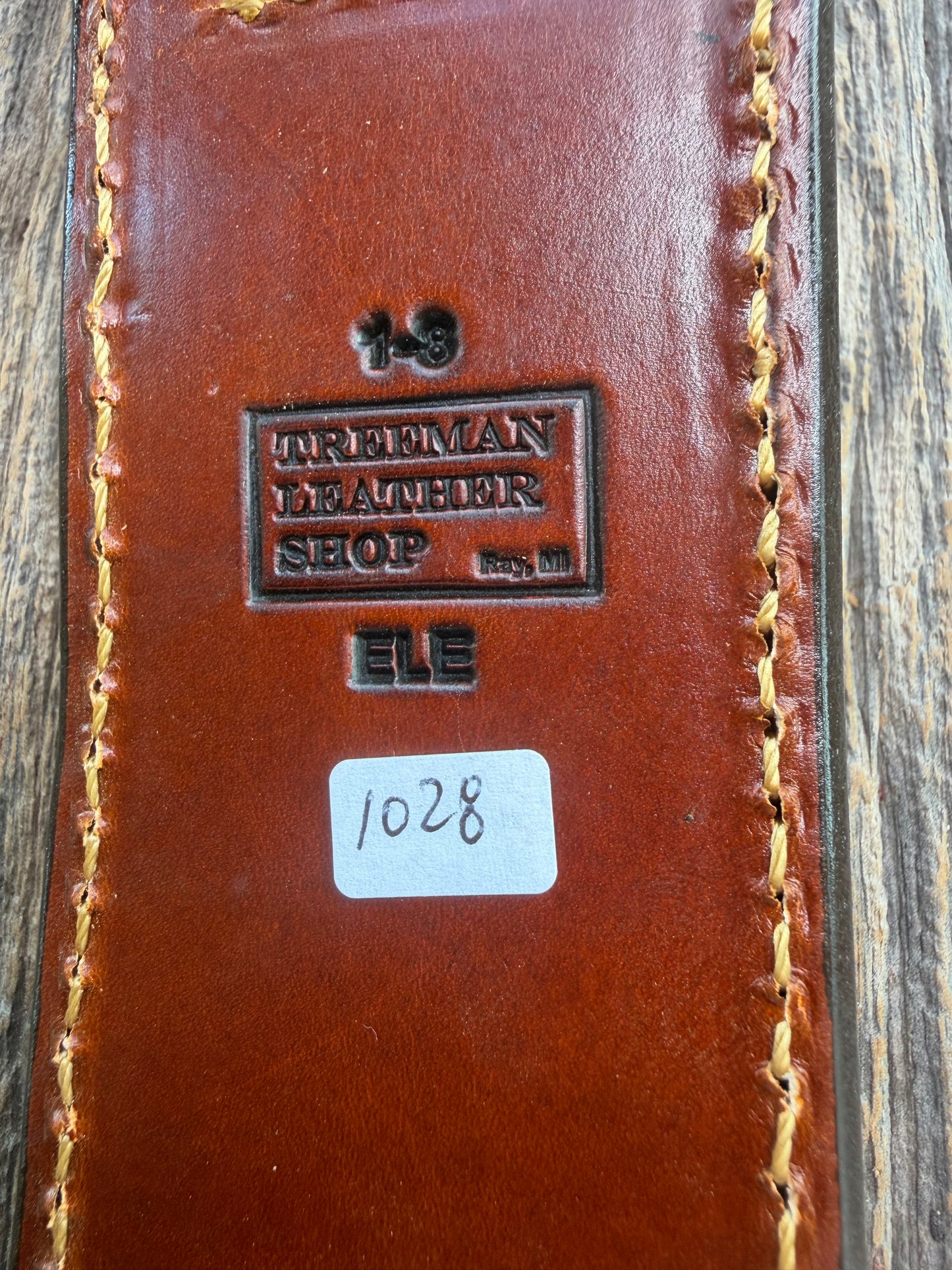 New Randall Model 1-8 Sheath in Exotic thick and textured Rust colored Elephant hide on brown leather from Treeman with a silver Canteen snap. Hand tooled belt loop. Killer sheath.
