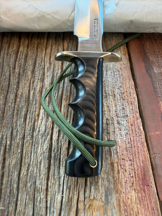 New in Paper Randall Model 16 SP#1 Special fighter with a Black Micarta handle. SS blade, Nickel silver hilt. Lanyard. Brown leather sheath.