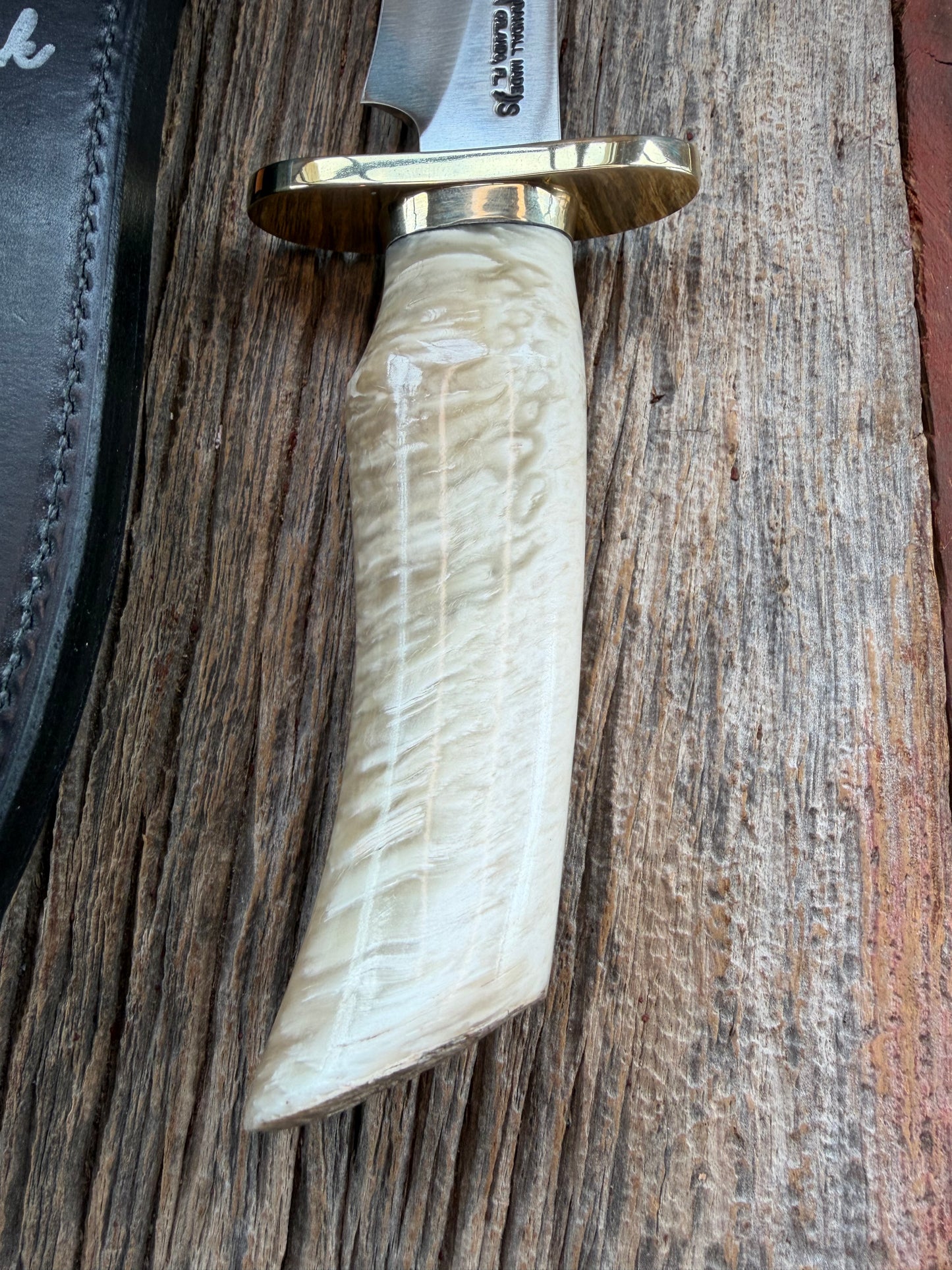 Randall Model 12-8 Small Sasquatch with a nice piece of Musk Ox. Nickel Silver collar and raw natural end.