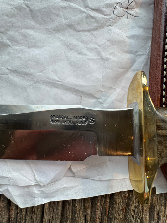 New in Paper Randall Model 16 SP#1 Special fighter with a Green Micarta handle. SS blade, Brass hilt. Lanyard. Brown leather sheath.