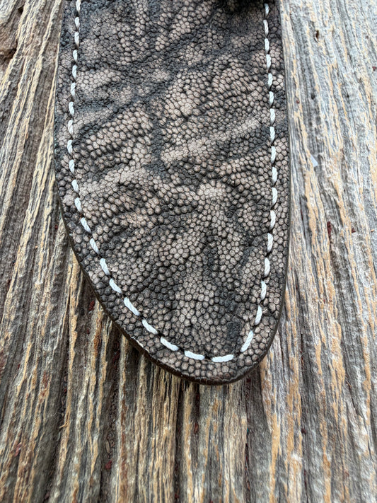 New Randall Model 23 Sheath in Exotic thick and textured Black and Grey Elephant Ear on brown leather from Treeman with a silver Canteen snap. Hand tooled belt loop. Killer sheath.