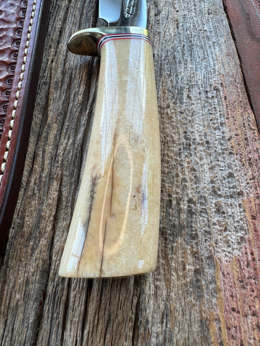 Randall Model 6-9 Filet knife in creamy Fossil Walrus. Extensively hand tooled Gutcher sheath, Nickel Silver Hilt and a natural end.