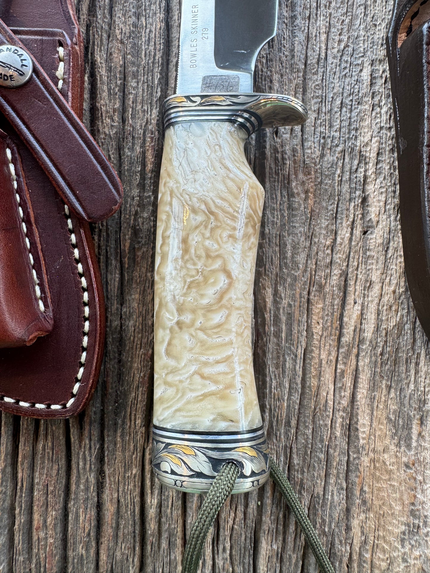 Randall Model Bowles Skinner Dealer Special Knife, perfect Musk Ox. This knife is a one of 4 per Rick Bowles. Beautifully engraved by Jere Davidson and adorned with gold and silver inlays.