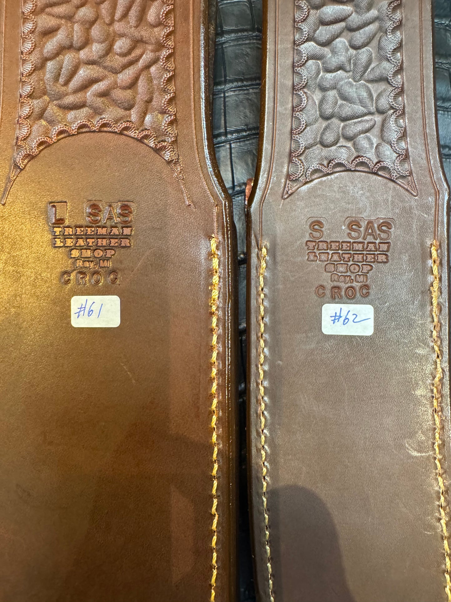 A pair of Randall Model 12-11 Large Sasquatch (Skull) and Randall Model 12-8 Small Sasquatch ( middle back) Sheaths in Exotic Tan Hornback Crocodile by Treeman.