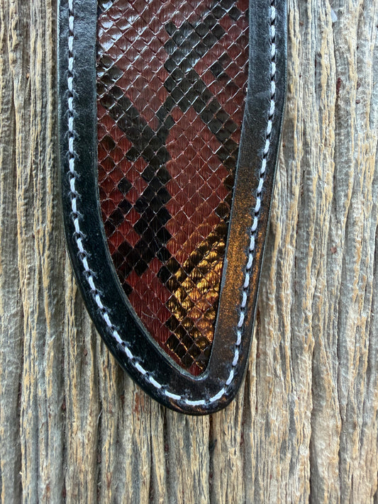 New Randall Model 1-6 Sheath in Exotic Brown Python Snake skin on black leather from Treeman with a black Canteen snap. Hand tooled belt loop. Deviated white stitching. Killer sheath.