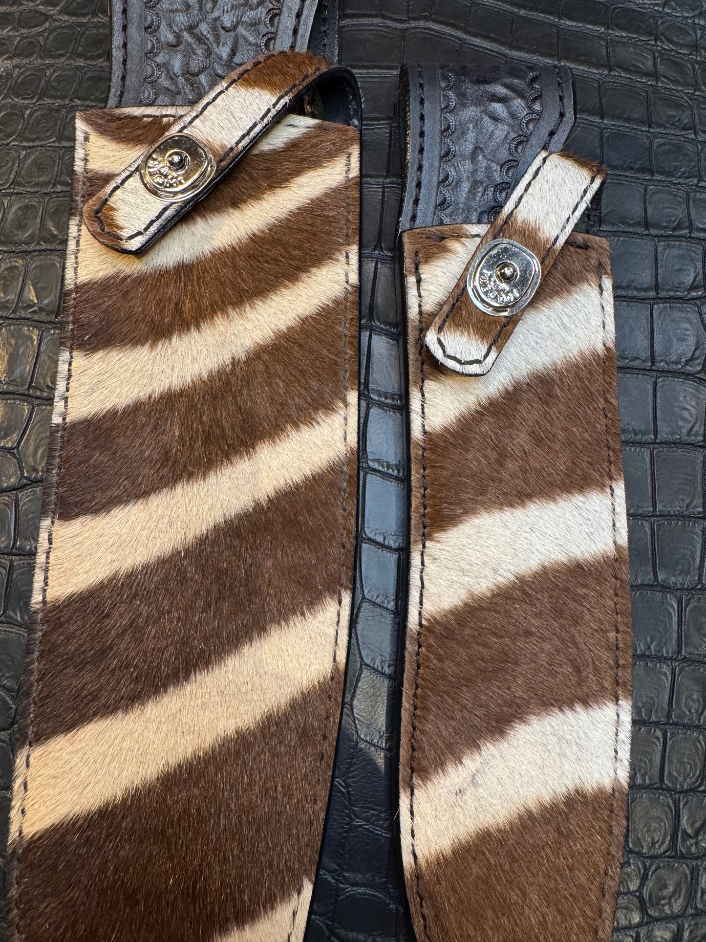 A pair of Randall Model 12-11 Large Sasquatch and Randall Model 12-8 Small Sasquatch Sheaths in Exotic Zebra by Treeman.
