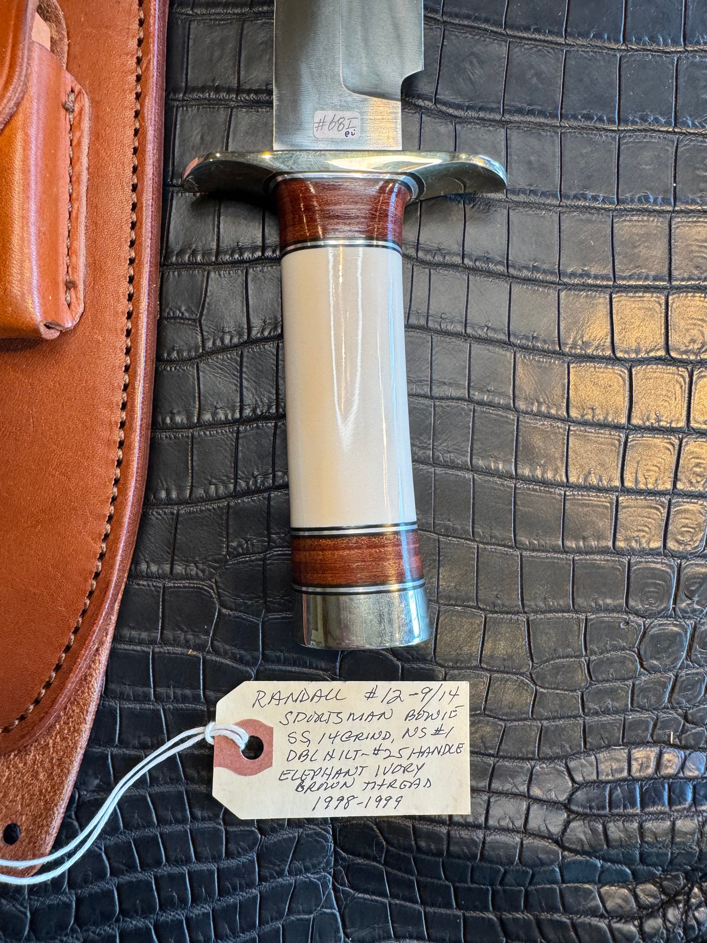 Randall Model 12/9-14 Grind Sportsman Bowie in Elephant Ivory with stacked Leather, Nickel Silver Hilt and Butt cap.