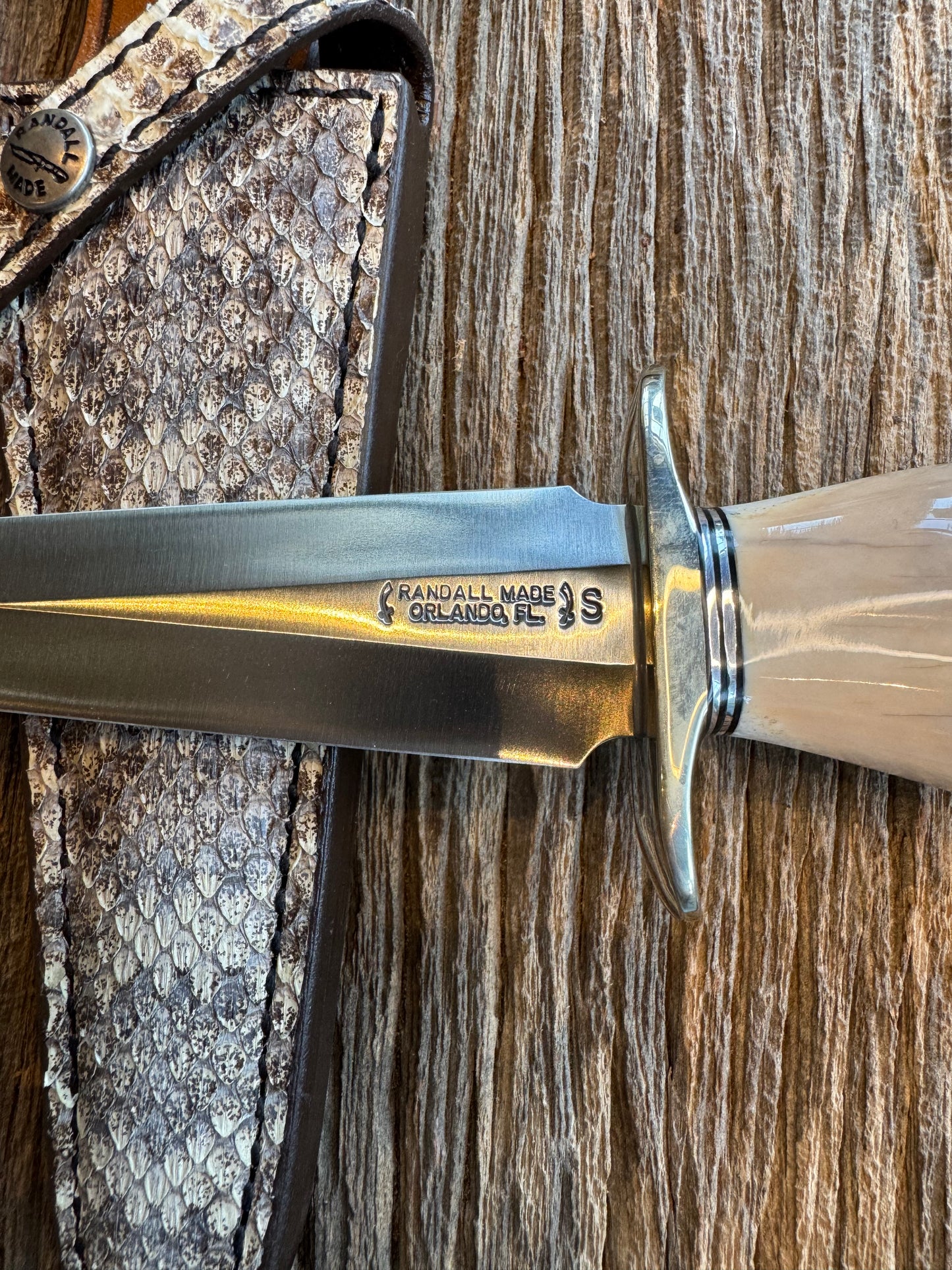 Randall Knife Model 13-6 Small Arkansas Toothpick Artifact. Fossil Walrus in an Ice Ax Handle. Included is a very rare Gutcher Rattlesnake sheath, Stainless Steel.