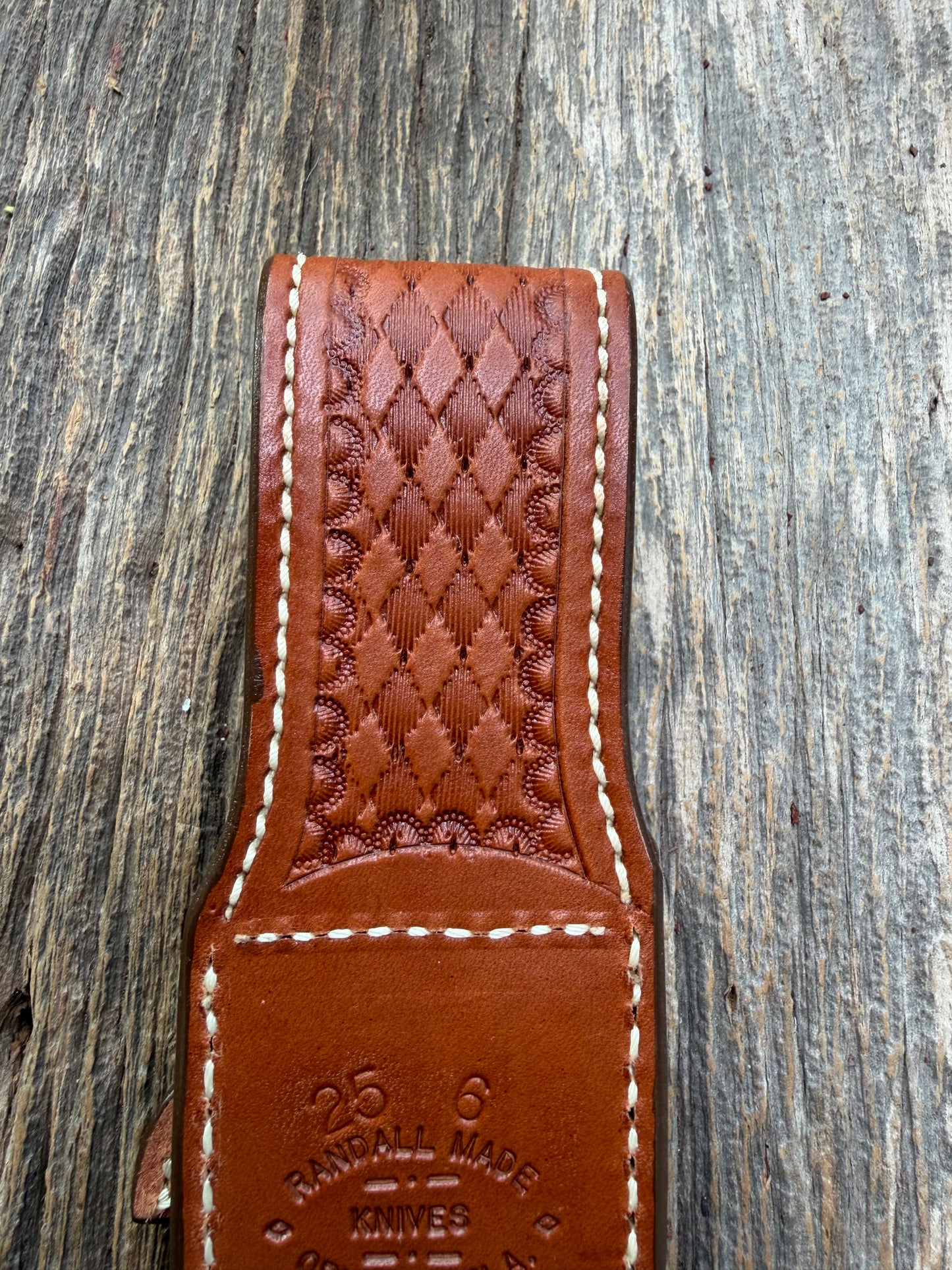 Pristine Randall Model 25-6 sheath in Exotic Cape Buffalo leather from Sullivans by Gutcher. Heavily tooled belt loop and strap. Randall snap and clean stamping on the back … perfect!!