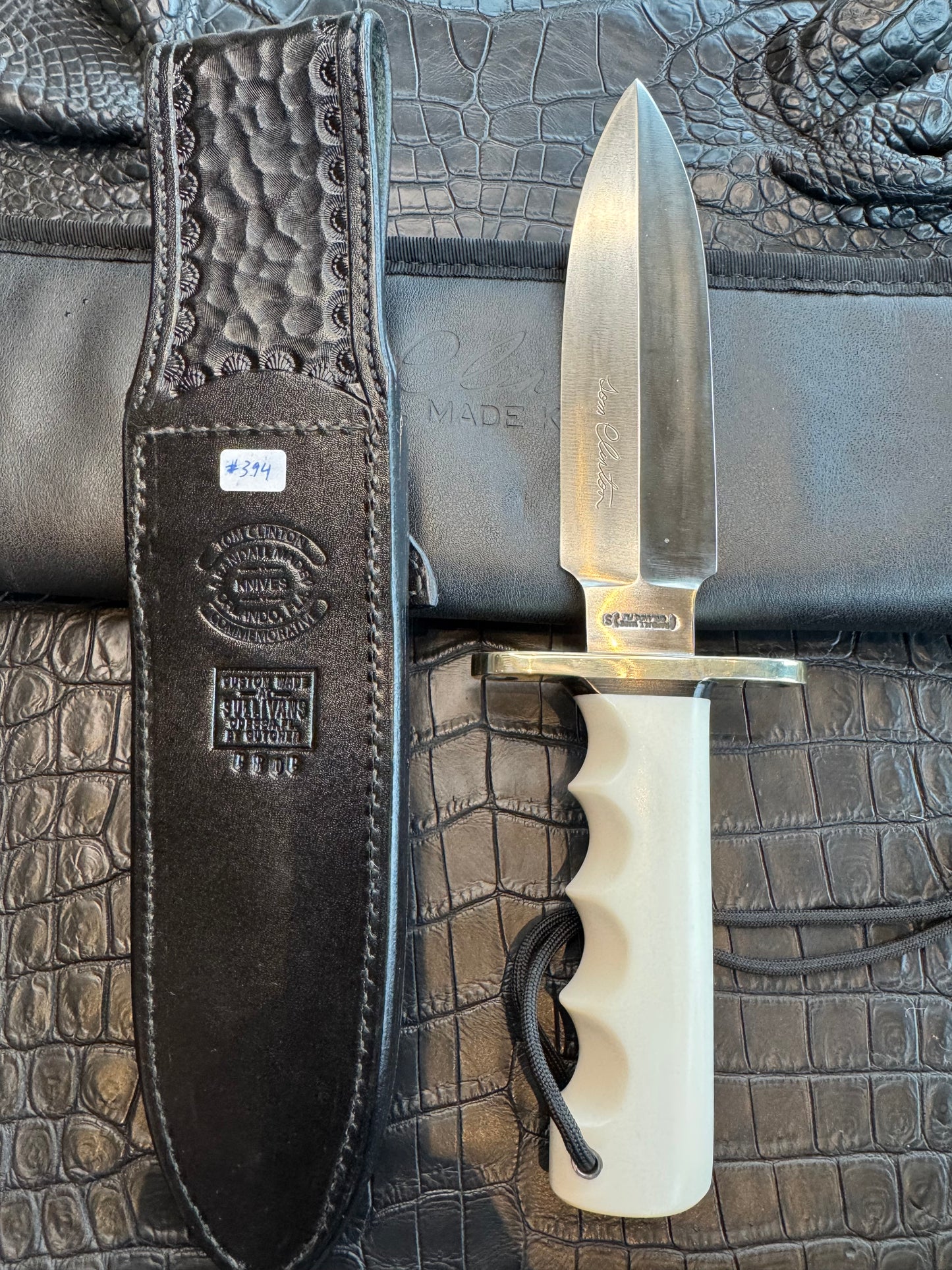 Randall Tom Clinton Dealer Special. Clinton Blade etched Commemorative 1/100 in a nice piece of finger grooved Ivorite. Very cool Black Crocodile skull Gutcher sheath. Nickel Silver Hilt. Included in black facsimile Tom Clinton case.