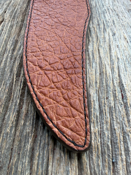 New Randall Model 12-8 Big Bear Sheath in Exotic thick and textured Rust colored Elephant hide on brown leather from Treeman with a black Canteen snap. Hand tooled belt loop. Killer sheath.