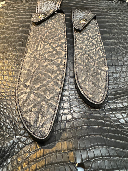 A pair of Randall Model 12-11 Large Sasquatch and Randall Model 12-8 Small Sasquatch Sheaths in Exotic Black Elephant by Treeman.
