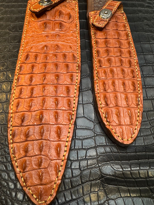 A pair of Randall Model 12-11 Large Sasquatch (Skull) and Randall Model 12-8 Small Sasquatch ( middle back) Sheaths in Exotic Tan Hornback Crocodile by Treeman.