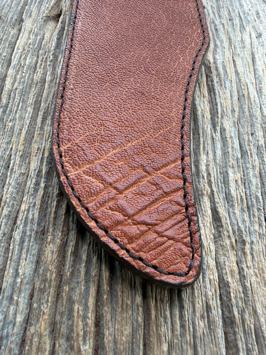 New Randall Model 12-11 Smithsonian Sheath in Exotic thick and textured Rust colored Elephant hide on brown leather from Treeman with a black Canteen snap. Hand tooled belt loop. Killer sheath.