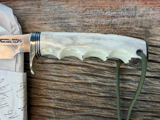 New in paper Randall Stanaback Special. Slabbed stag finger groove handle. This is the large Stanaback version with a Stainless 4 1/2” Blade, Nickel Silver Single Hilt and Silver & Black Spacers.