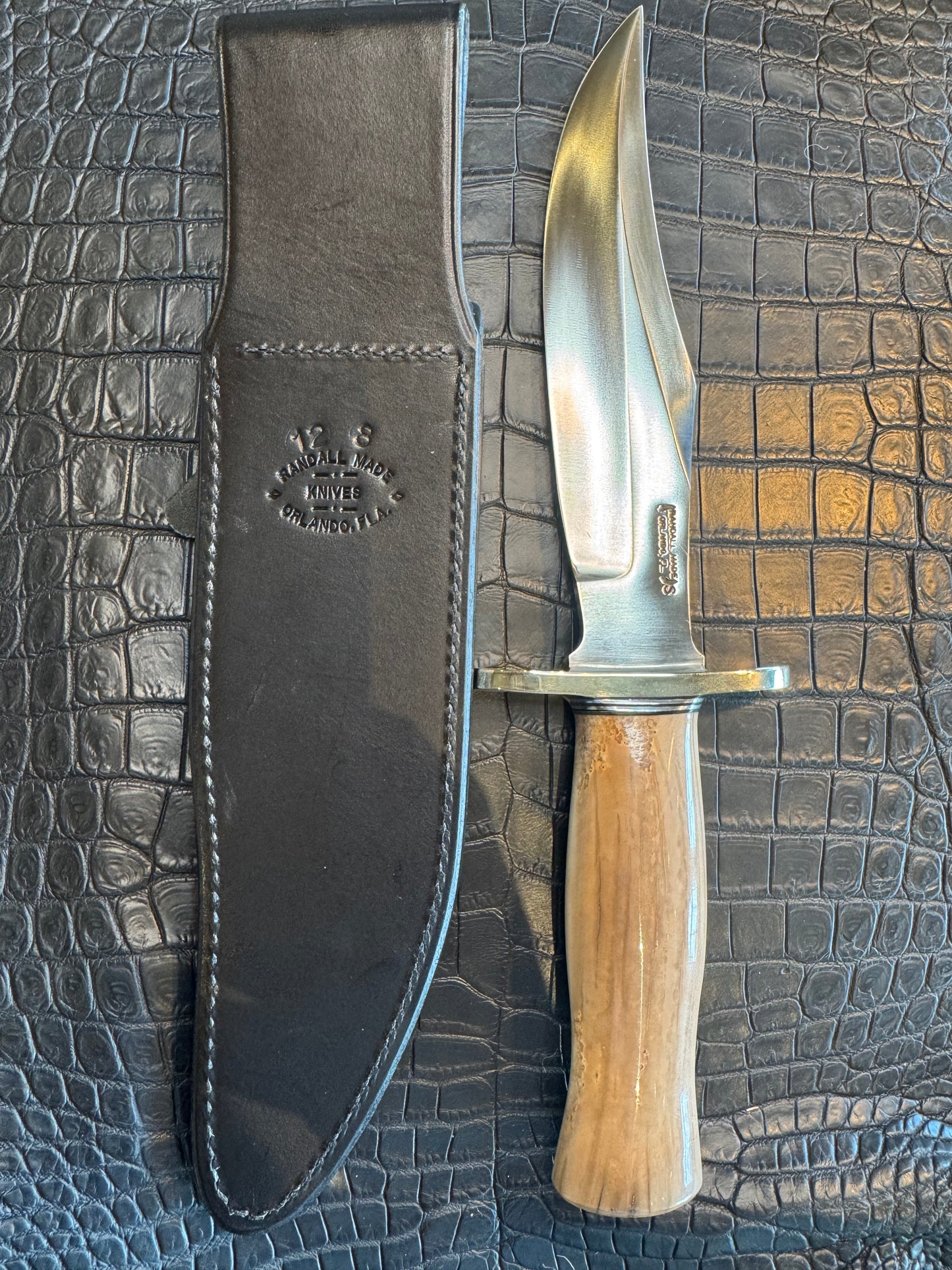 Randall Model 12-8 Big Bear in a gorgeous piece of Creamy Fossil Walrus Ivory. Nickel Silver Hilt and a natural exposed end.