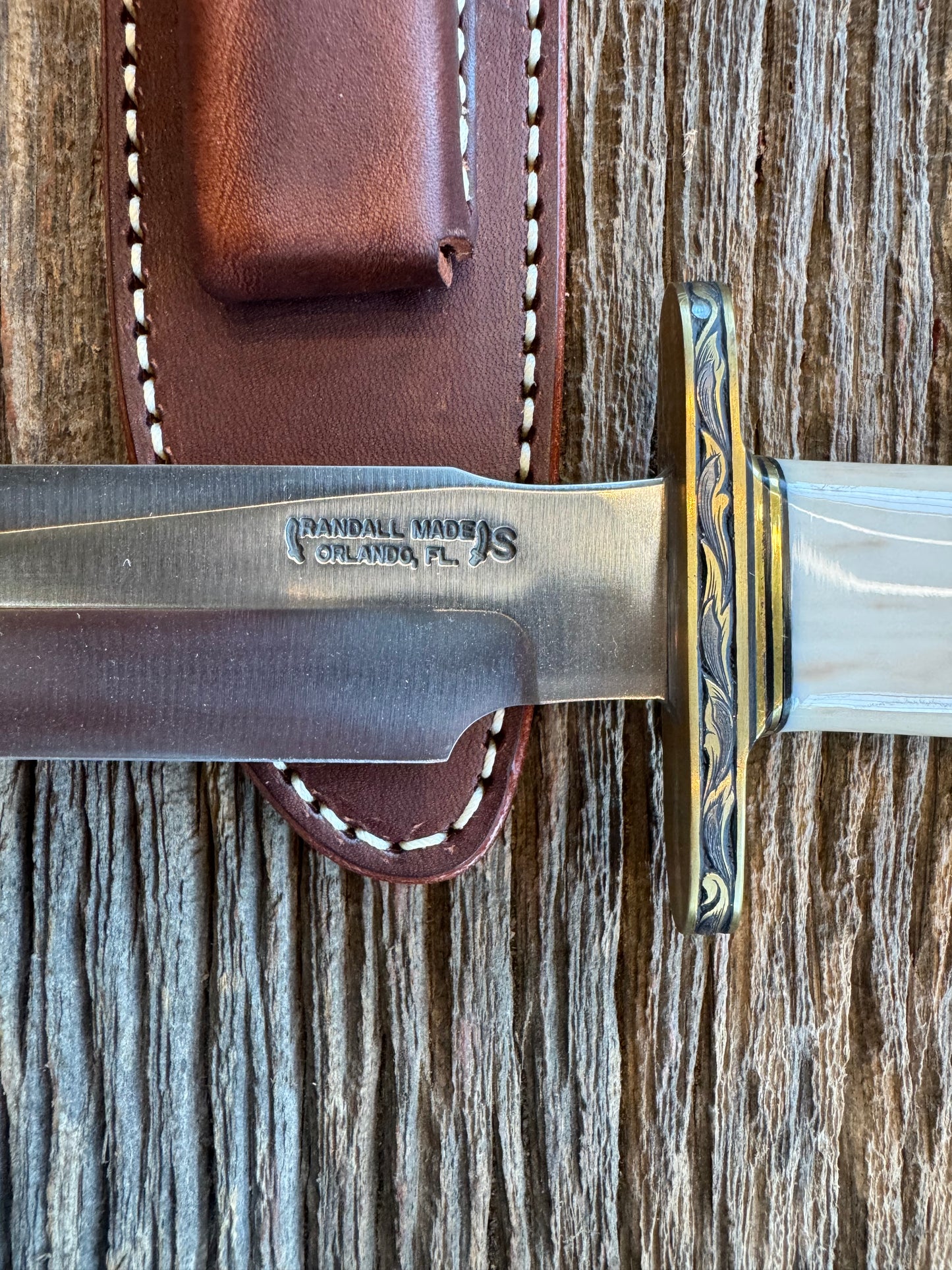 Randall Knife Model 1-7 FWI Handle. Jere Davidson engraved into Brass. Stainless Steel Blade. Stunning knife.