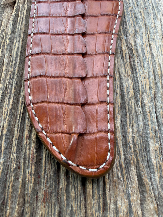New Randall Model 12-11 Confederate Sheath in Exotic thick and textured Honey Crocodile skin ( tail portion) on brown leather from Treeman with a silver Canteen snap. Hand tooled belt loop. Killer sheath.