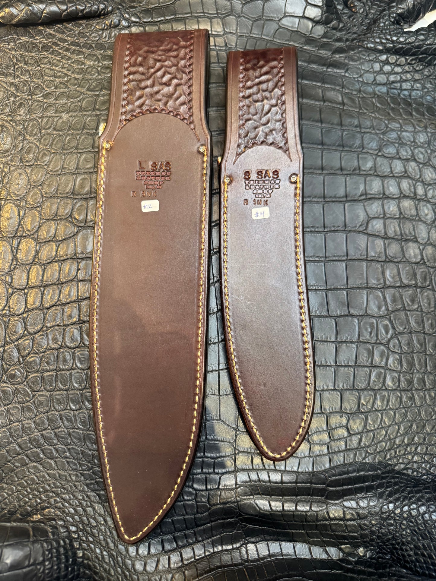 A pair of Randall Model 12-11 Large Sasquatch and Randall Model 12-8 Small Sasquatch Sheaths in Exotic Vibrant Diamond Pattern Rattlesnake skin by Treeman.
