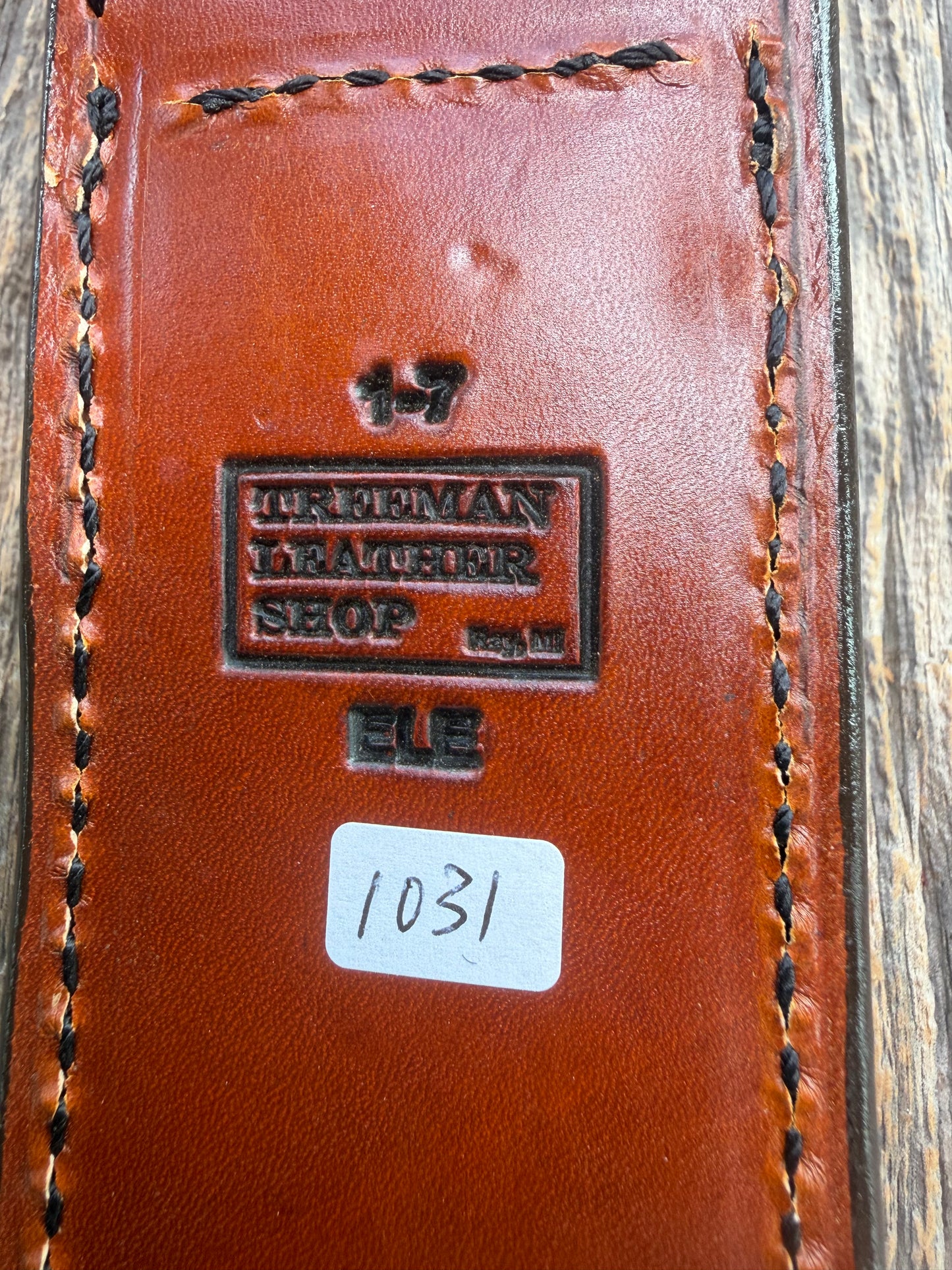 New Randall Model 1-7 Sheath in Exotic thick and textured Rust colored Elephant hide on brown leather from Treeman with a black Canteen snap. Hand tooled belt loop. Killer sheath.