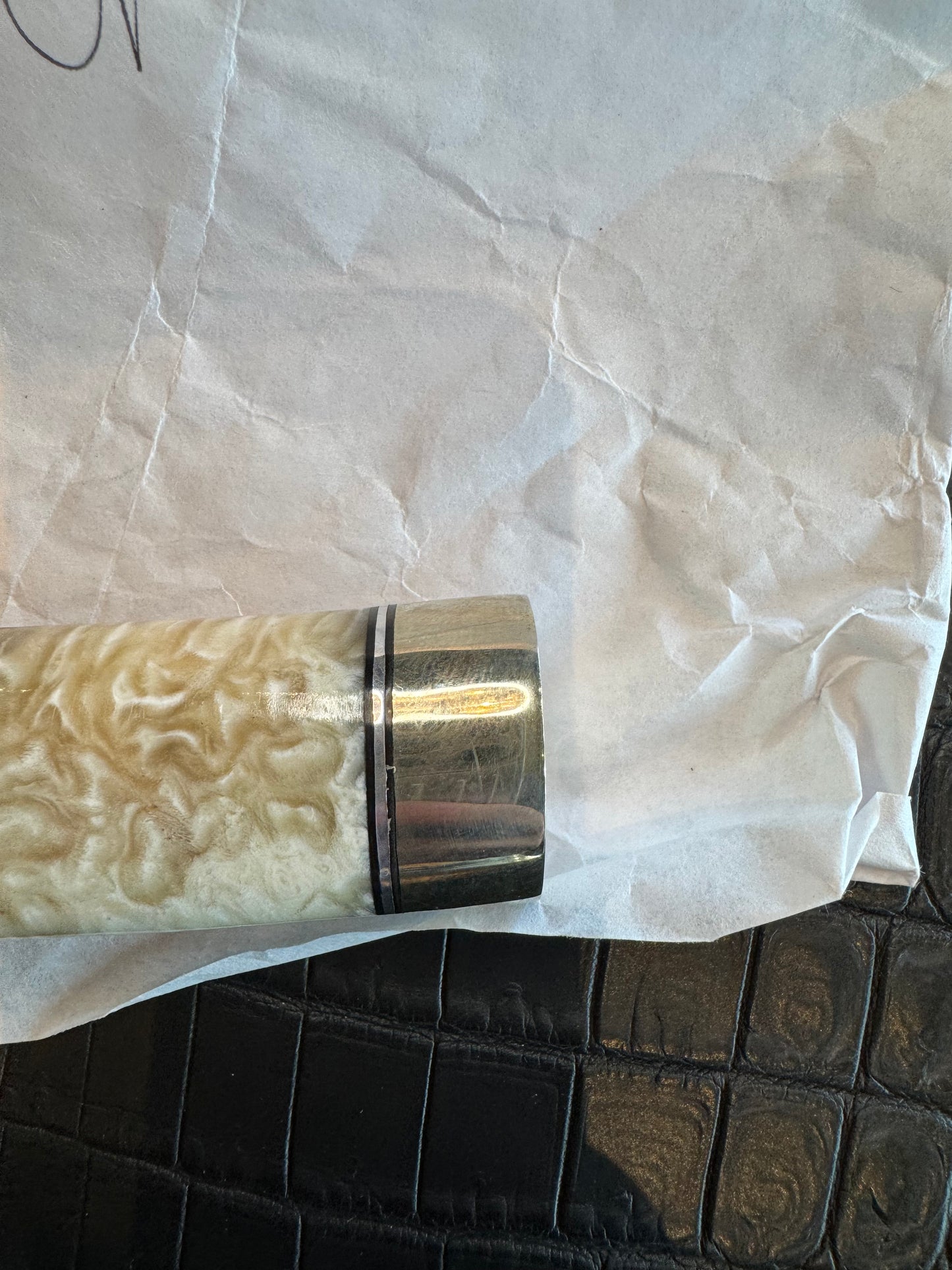 In Paper Randall Model 12-6 in Musk Ox. Lead Bullet Fragment embedded in the Musk ox. Nickel Silver Hilt and butt cap.
