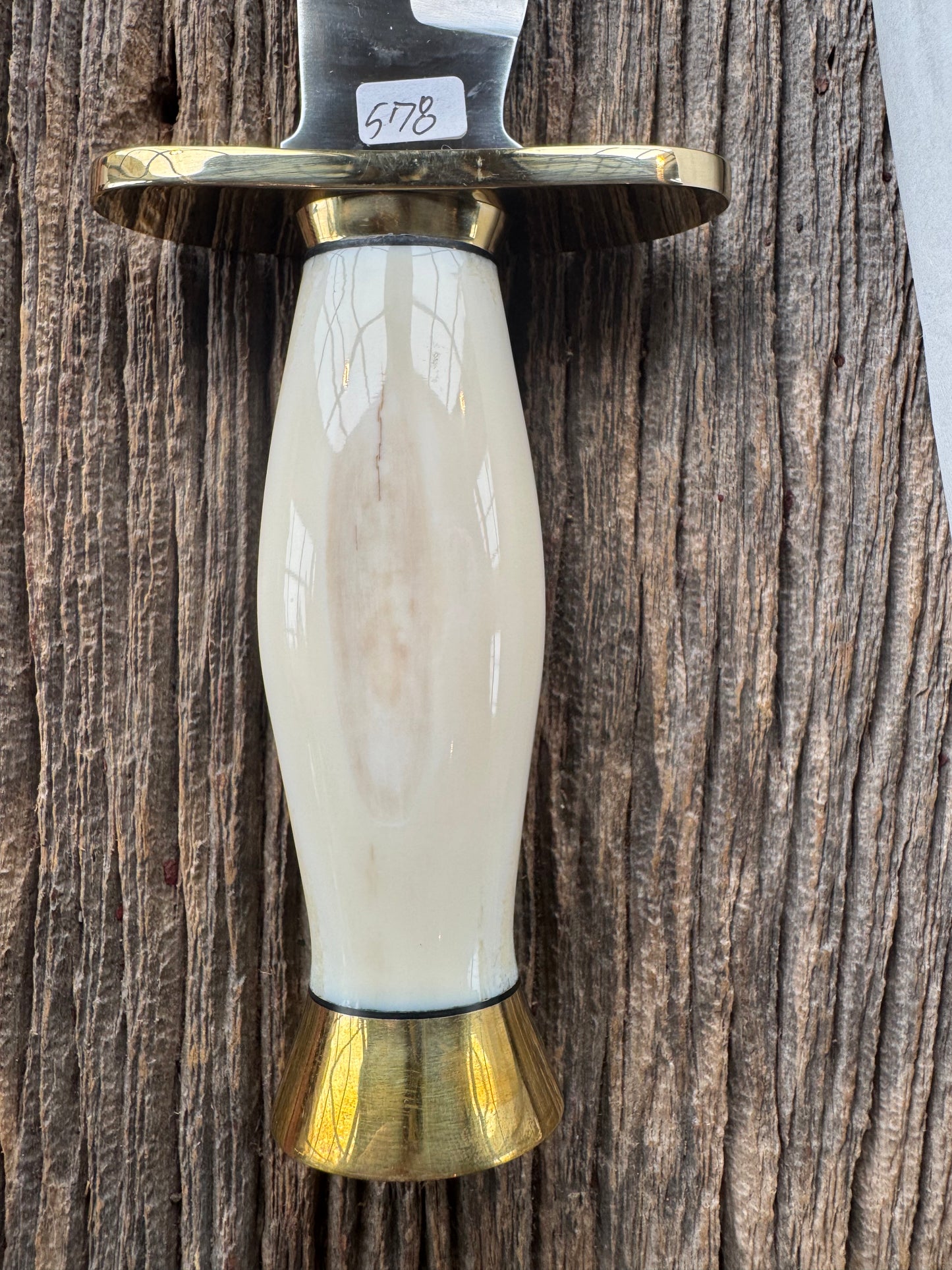 New in paper Randall Knife Model 12-8 Big Bear. Gorgeous piece of off white Fossil Walrus Ivory. Brass hilt, collar and butt cap, Stainless steel.