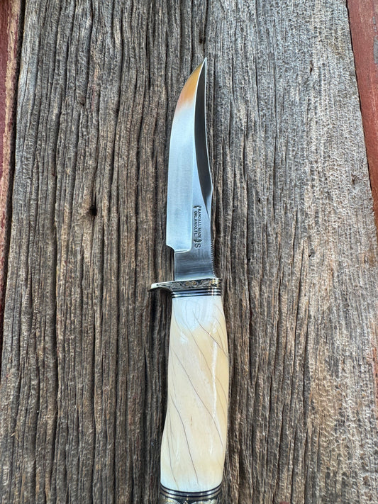 Rare Randall Model 12-6 in Beautiful Spiraled Narwal, Joe Mason engraved with gold inlay. Nickel Silver Hilt and butt cap, black and silver spacers. SS Stunning and rare.